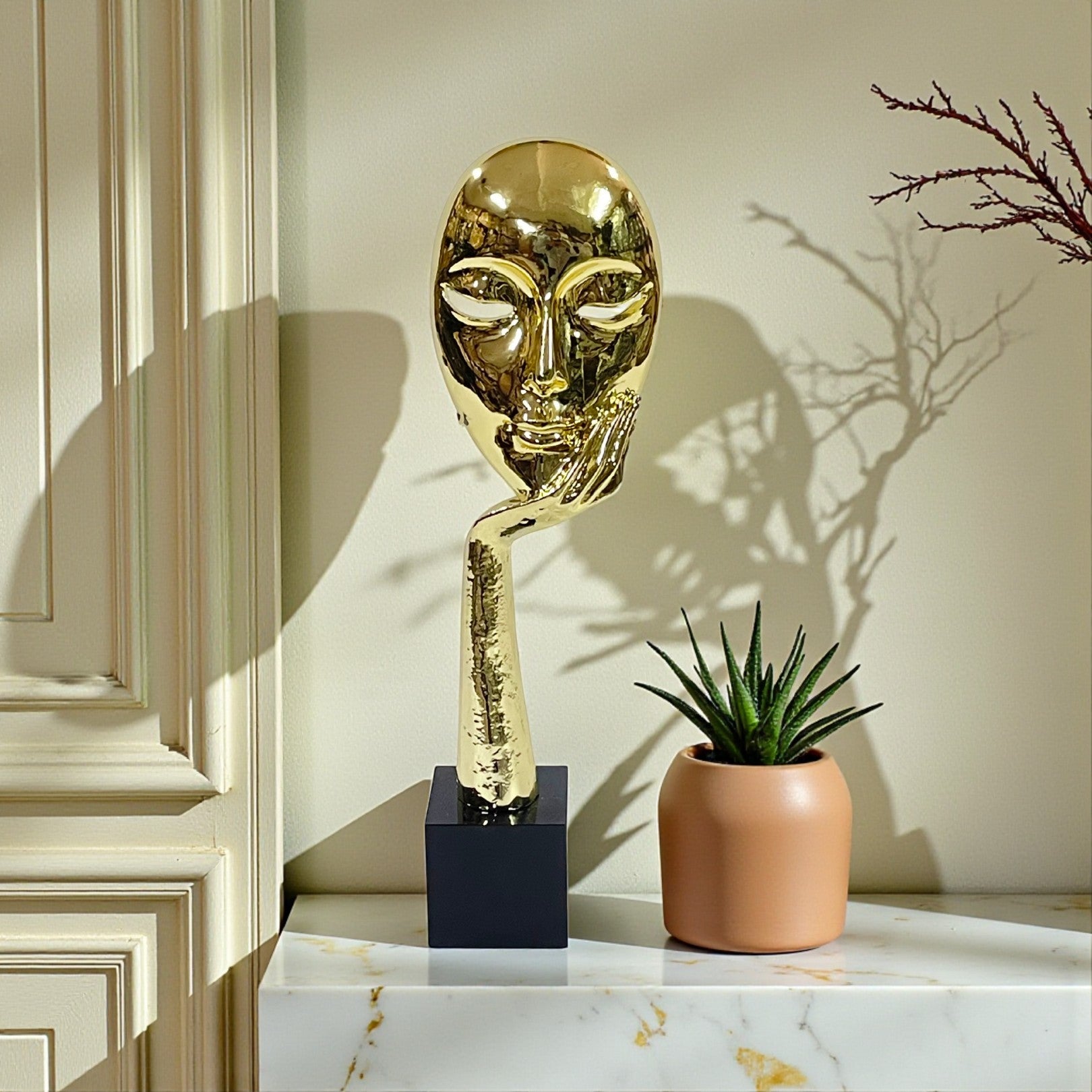 Gold Abstract Face & Hand Sculpture