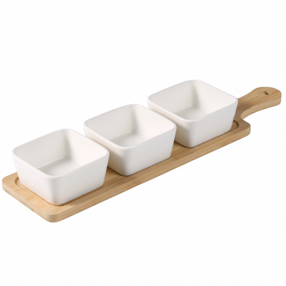 Set of three square ceramic bowls on a wooden tray with a white background