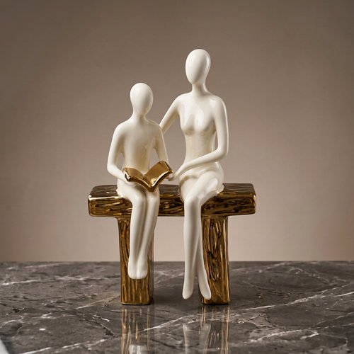 Elegant Seated Reading Duo Sculpture
