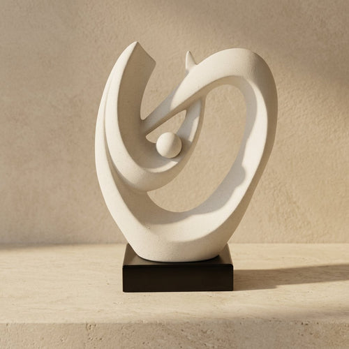 Elegant White Speckled Swirling Shell Statue