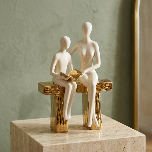 Elegant Seated Reading Duo Sculpture