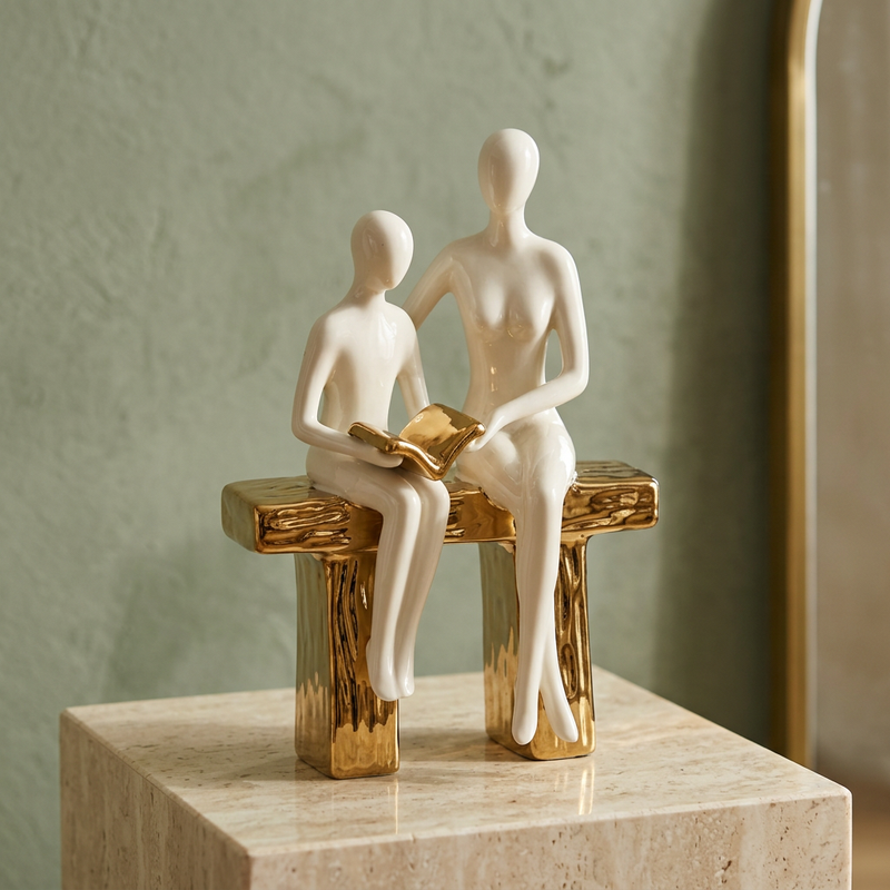 Elegant Seated Reading Duo Sculpture