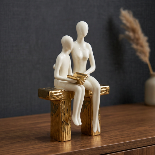 Elegant Seated Reading Duo Sculpture