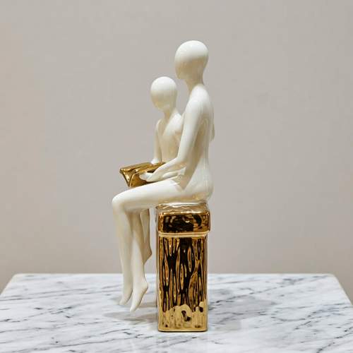Elegant Seated Reading Duo Sculpture