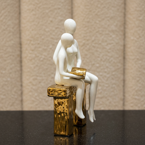 Elegant Seated Reading Duo Sculpture