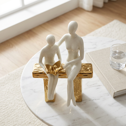Elegant Seated Reading Duo Sculpture