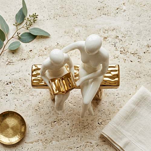 Elegant Seated Reading Duo Sculpture