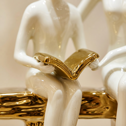 Elegant Seated Reading Duo Sculpture