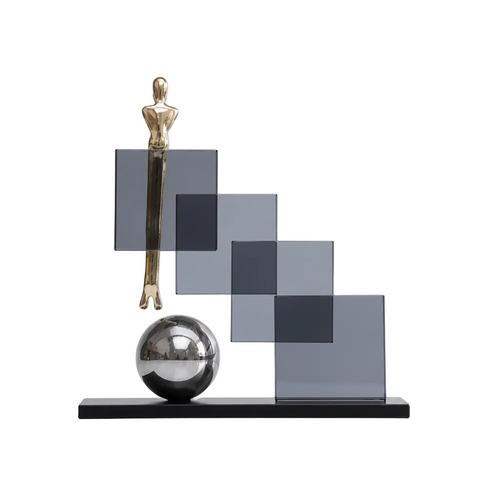 Decorative sculpture with geometric shapes and a reflective sphere on a white background