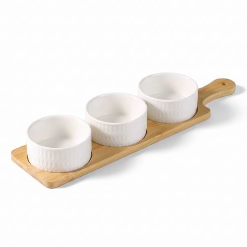 Set of four white ceramic bowls on a wooden tray with a white background