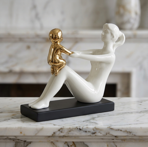 Modernist Mother Holding Child Statue
