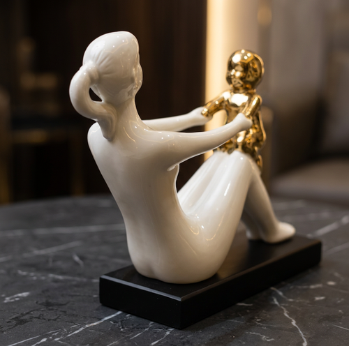 Modernist Mother Holding Child Statue