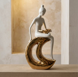 Elegant Reader on Crescent Moon Sculpture