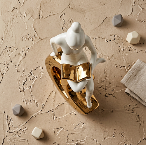 Elegant Reader on Crescent Moon Sculpture