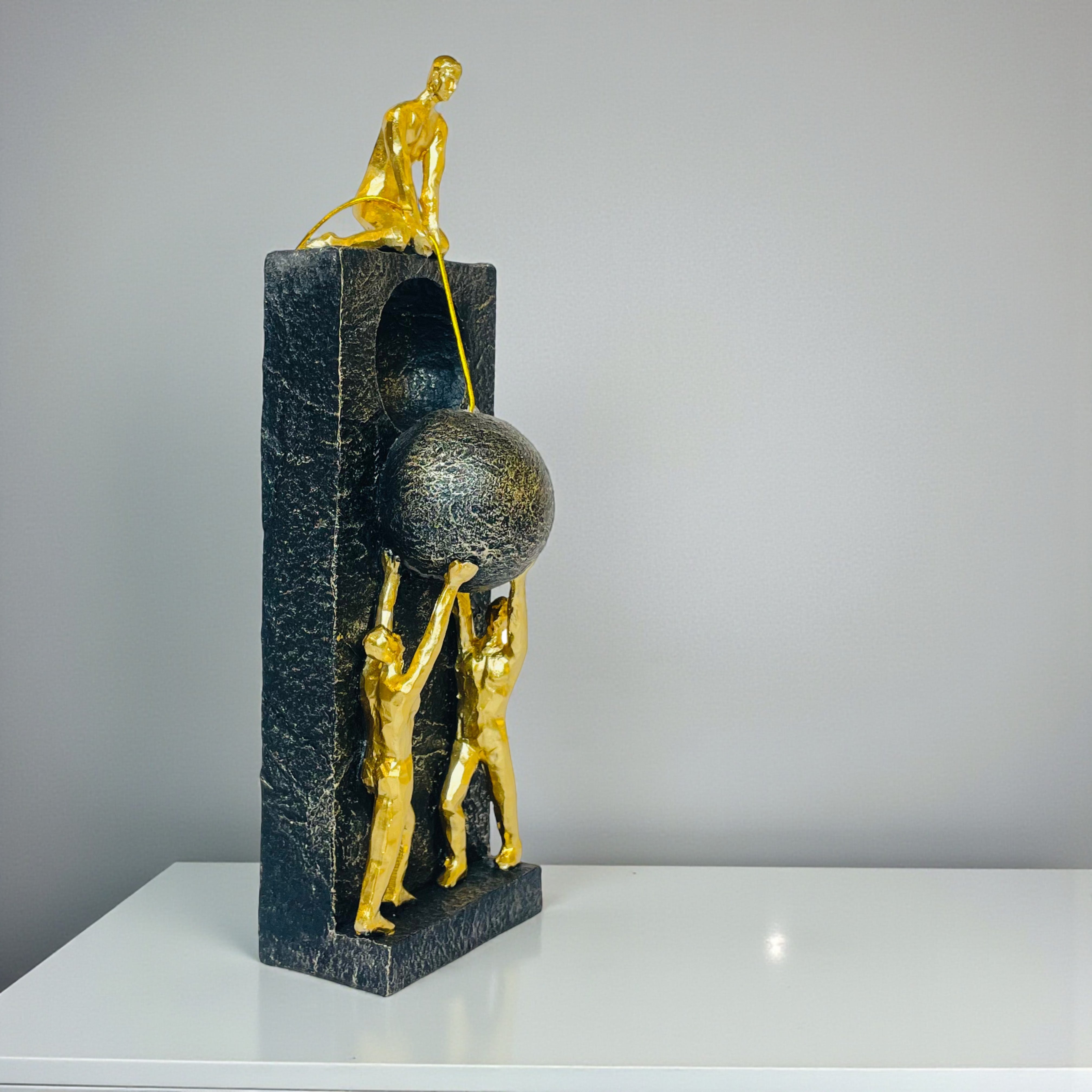 Abstract Teamwork Sculpture – Golden Figures with Sphere on Black Base