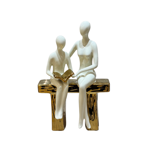 Elegant Seated Reading Duo Sculpture